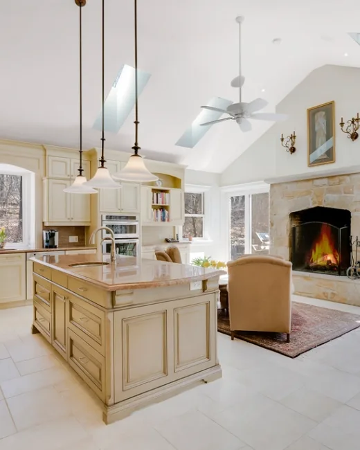 Bright kitchen with a tiled floor and stone countertops